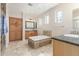 Elegant bathroom with soaking tub, double vanity, and walk-in shower at 2614 W Florimond Rd, Phoenix, AZ 85086