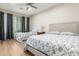 Bedroom with two beds, hardwood floors and window coverings at 2614 W Florimond Rd, Phoenix, AZ 85086