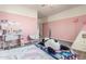 Bright bedroom with a desk, bed, and playful decor at 2614 W Florimond Rd, Phoenix, AZ 85086