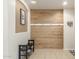 Entryway with wood-look wall, bench, and coat hooks at 2614 W Florimond Rd, Phoenix, AZ 85086