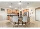 Eat-in kitchen with breakfast bar and pendant lighting at 2614 W Florimond Rd, Phoenix, AZ 85086