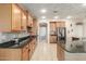 Spacious kitchen featuring granite countertops and ample cabinetry at 2614 W Florimond Rd, Phoenix, AZ 85086