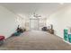 Open living area with ceiling fan, comfortable seating, and large windows at 2614 W Florimond Rd, Phoenix, AZ 85086