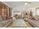 Open concept living room with kitchen view and wood floors at 2614 W Florimond Rd, Phoenix, AZ 85086