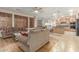Living room with kitchen view, wood floors, and neutral decor at 2614 W Florimond Rd, Phoenix, AZ 85086