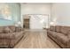 Spacious living room with hardwood floors and access to kitchen at 2614 W Florimond Rd, Phoenix, AZ 85086