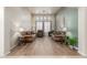 Living room with two sofas, wood floors, and neutral decor at 2614 W Florimond Rd, Phoenix, AZ 85086