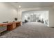 Spacious loft area with wood desk and access to a balcony at 2614 W Florimond Rd, Phoenix, AZ 85086