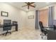 Home office with two workstations and ceiling fan at 2614 W Florimond Rd, Phoenix, AZ 85086