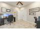 Home office with two work stations and built-in shelving at 2614 W Florimond Rd, Phoenix, AZ 85086