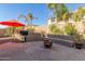 Outdoor patio with built-in BBQ and fire pit at 2614 W Florimond Rd, Phoenix, AZ 85086