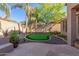 Landscaped backyard with a putting green at 2614 W Florimond Rd, Phoenix, AZ 85086