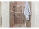 Walk-in shower with glass enclosure and tiled walls at 2614 W Florimond Rd, Phoenix, AZ 85086