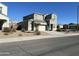 Two-story house with gray siding, attached garage, and desert landscaping at 30770 W Mitchell Dr, Buckeye, AZ 85396