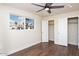 Bedroom with hardwood floors, closets and window at 3215 E Captain Dreyfus Ave, Phoenix, AZ 85032