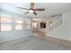 Spacious living room with ceiling fan and carpet at 3287 E Morning Star Ln, Gilbert, AZ 85298