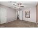 Spacious bedroom with double doors and ceiling fan at 3331 S Vine St, Chandler, AZ 85248
