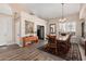 Formal dining room with a large table and hardwood floors at 3331 S Vine St, Chandler, AZ 85248
