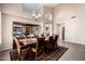 Spacious dining room featuring a large table and built-in hutch at 3331 S Vine St, Chandler, AZ 85248