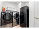 Laundry room with washer, dryer, and refrigerator at 3331 S Vine St, Chandler, AZ 85248