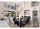 Two-story living room with a fireplace, built-ins, and pool view at 3331 S Vine St, Chandler, AZ 85248