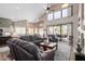 Spacious living room with high ceilings, fireplace, and access to backyard at 3331 S Vine St, Chandler, AZ 85248