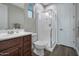 Modern bathroom with walk-in shower and wood flooring at 3392 E Strawberry Dr, Gilbert, AZ 85298