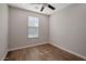 Simple bedroom with wood flooring and ceiling fan at 3392 E Strawberry Dr, Gilbert, AZ 85298