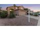 Stunning two-story home exterior with a two-car garage at sunset at 343 W Bolero Dr, Tempe, AZ 85284