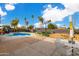 Inviting backyard oasis featuring a sparkling pool, patio furniture, and lush landscaping at 3502 W Ironwood Dr, Phoenix, AZ 85051