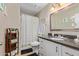 Clean bathroom with vanity, toilet, shower, and decorative accents at 3502 W Ironwood Dr, Phoenix, AZ 85051