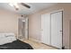 Bedroom with a bed, double door closet, and access to hallway at 3502 W Ironwood Dr, Phoenix, AZ 85051