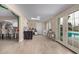 Bright Gathering room with pool view and access to kitchen at 3502 W Ironwood Dr, Phoenix, AZ 85051