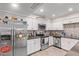 Updated kitchen with stainless steel appliances and white cabinets at 3502 W Ironwood Dr, Phoenix, AZ 85051