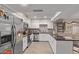 Modern kitchen with stainless steel appliances and an island at 3502 W Ironwood Dr, Phoenix, AZ 85051