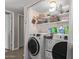 Laundry room with washer, dryer, and shelving at 3502 W Ironwood Dr, Phoenix, AZ 85051