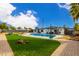 Stunning pool and backyard with artificial turf and a spacious patio area at 3502 W Ironwood Dr, Phoenix, AZ 85051