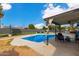 Relaxing poolside patio with covered seating and a refreshing pool at 3502 W Ironwood Dr, Phoenix, AZ 85051