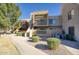 Attractive exterior of a two-story condo with walkway and landscaping at 3600 N Hayden Rd # 3420, Scottsdale, AZ 85251