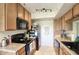 Well-equipped kitchen with wood cabinets and granite countertops at 3600 N Hayden Rd # 3420, Scottsdale, AZ 85251