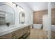 Elegant bathroom with double vanity, soaking tub, and modern fixtures at 3871 W Jasper Dr, Chandler, AZ 85226