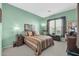 Comfortable bedroom with striped bedding and window at 4041 E Rakestraw Ln, Gilbert, AZ 85298