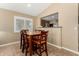 Bright dining area with wood table and chairs, adjacent to kitchen at 5 E Zinnia Pl, San Tan Valley, AZ 85143