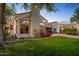 Spacious backyard with lush lawn and a view of the home at 5403 E Cannon Dr, Paradise Valley, AZ 85253