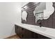 Stylish bathroom featuring dual sinks, unique mirrors and geometric backsplash tiling at 5403 E Cannon Dr, Paradise Valley, AZ 85253