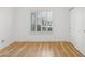 Bright bedroom with wood floors, shutters, and white trim at 5403 E Cannon Dr, Paradise Valley, AZ 85253