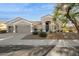 Single-story home with a two-car garage and desert landscaping at 5403 E Cannon Dr, Paradise Valley, AZ 85253