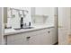Convenient laundry room with sink, cabinets, and modern appliances at 5403 E Cannon Dr, Paradise Valley, AZ 85253