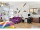 Bright living room features colorful rug, purple sofa, and large windows at 5403 E Cannon Dr, Paradise Valley, AZ 85253