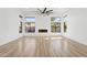 Large open living space with vaulted ceilings, expansive windows, and modern gas fireplace at 5403 E Cannon Dr, Paradise Valley, AZ 85253